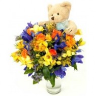 Assorted flowers with teddy bear
