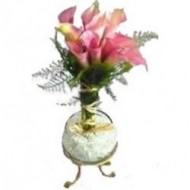 Glass vase of callas