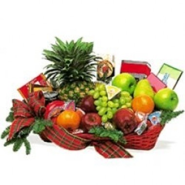 Basket with fruits and candies