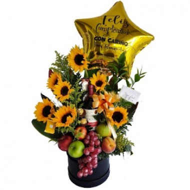 Sunflowers with fruits, wine and chocolates