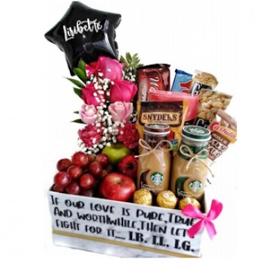 Basket of snacks and pink flowers