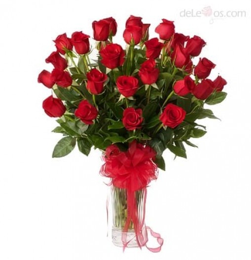 Three dozen roses in a glass vase