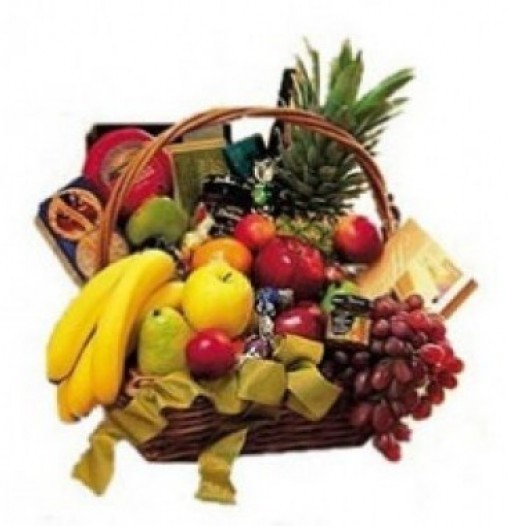 Basket of season fruits, cookies, cheeses chocolates and wine