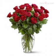 Two dozen roses in a glass vase